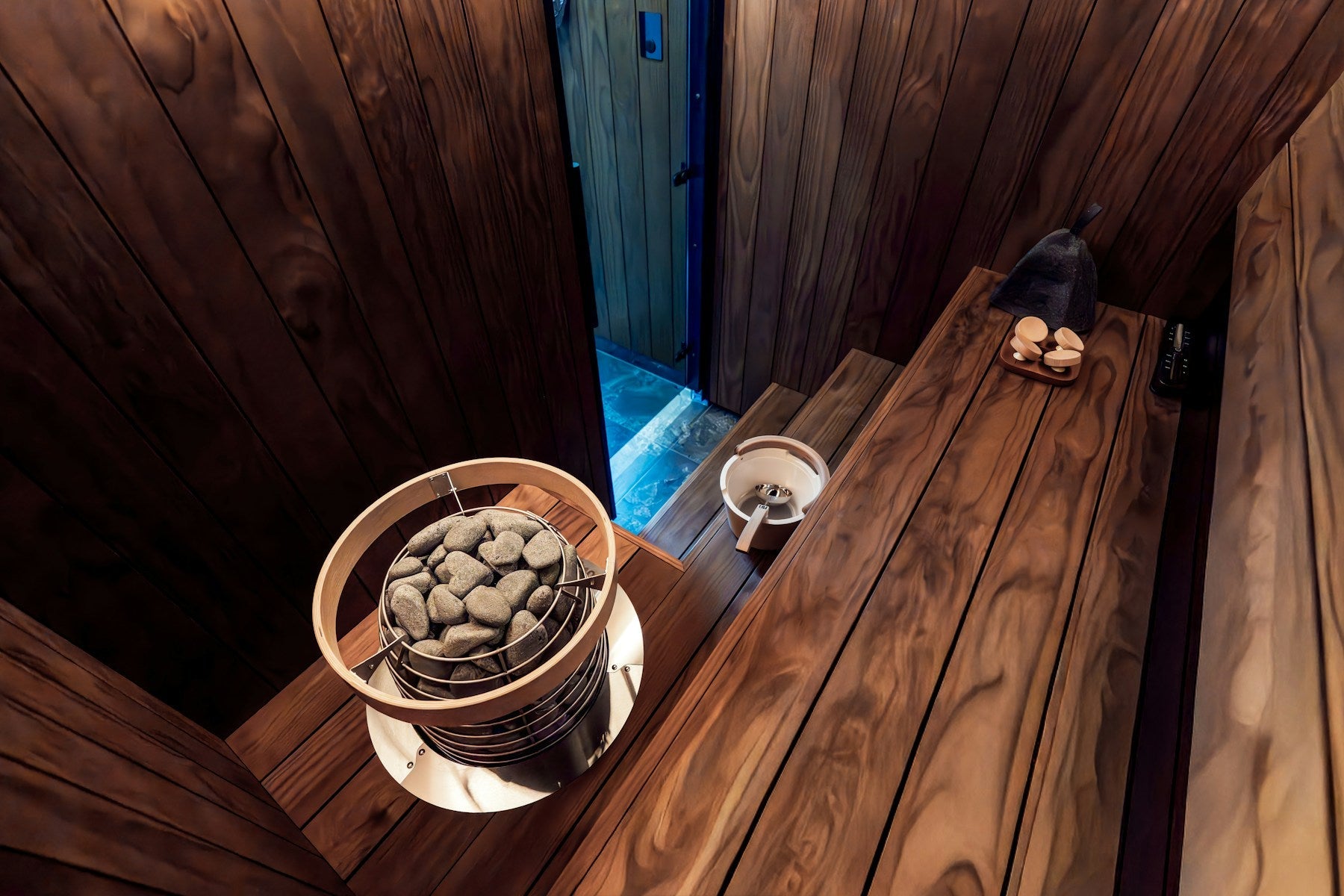 Natural wood sauna and hot stones for Toffee Rest & Restore mood