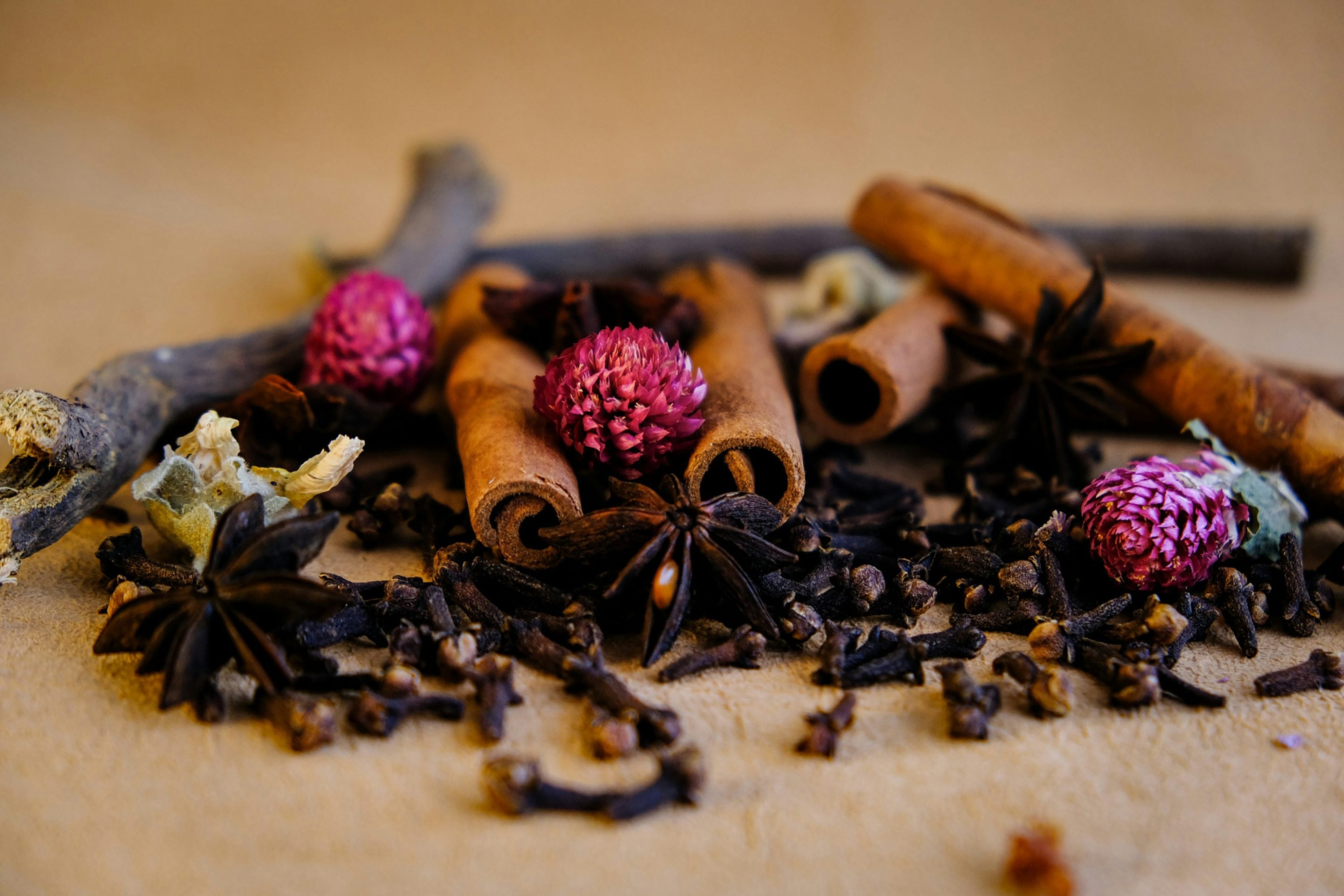 Cinnamon sticks, cloves and star anise representing the warm spice notes of Pumpkin Spice